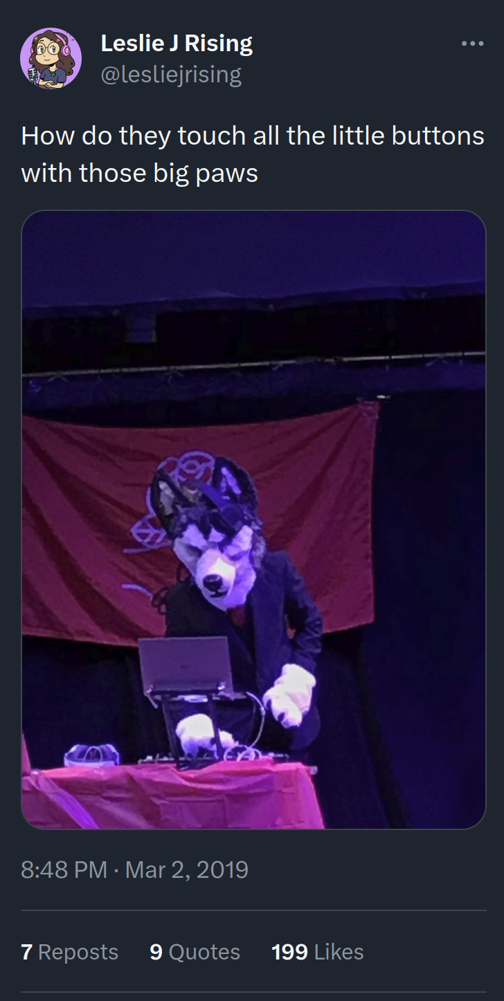A twitter post from Leslie J Rising that shows Huxley at the decks and reads, 'How do they touch all the little buttons with those big paws'